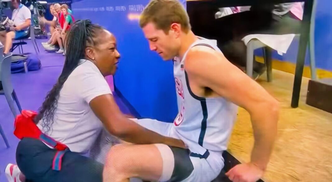 Team USA Trainer Becomes Viral Sensation After Cameras Capture Her Unusual Position While Attending to Injured Player on the Bench [VIDEO]